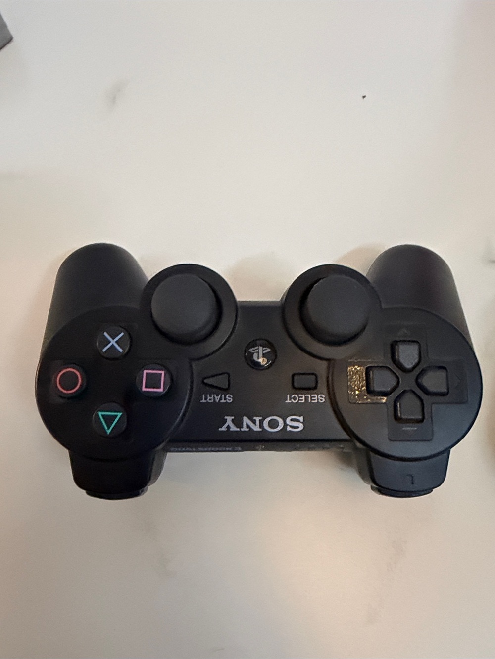 Sony Black Wireless PlayStation Controller with Iconic Button Colors